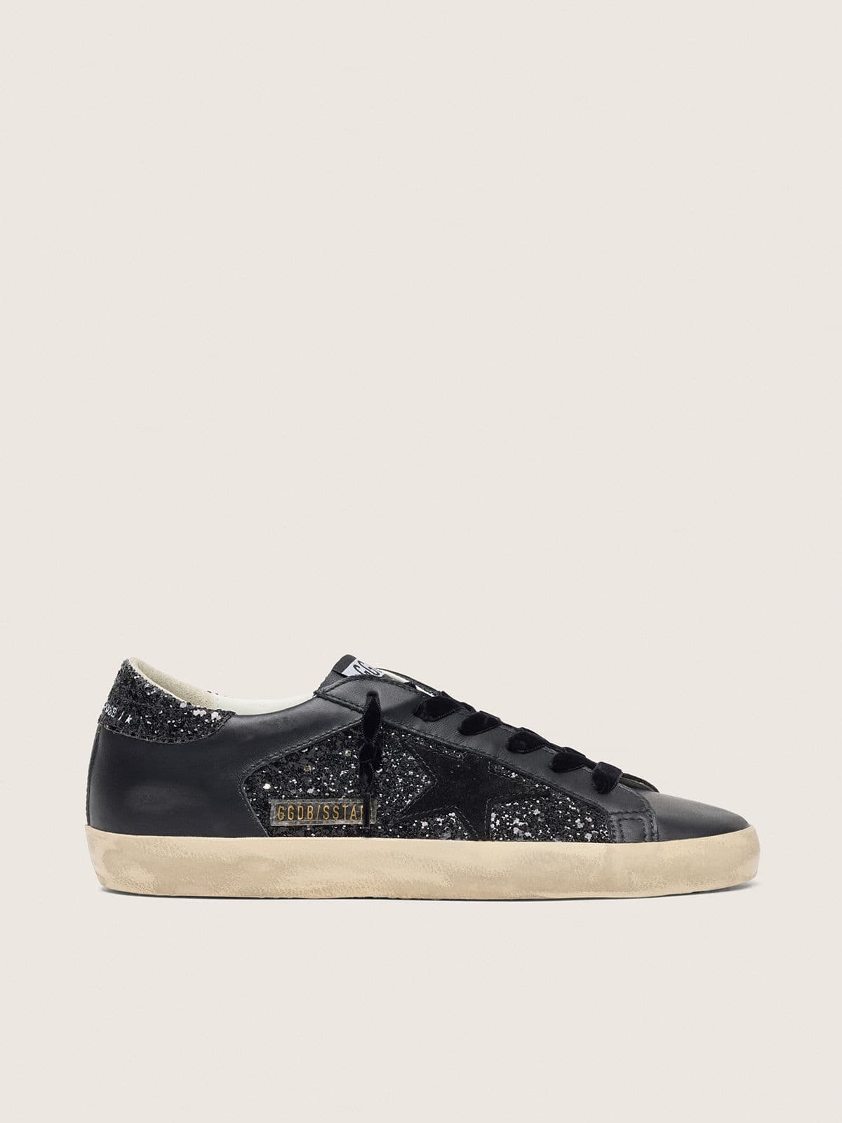 Super-Star pour femme à paillettes noires avec étoile en daim noir et empiècements en cuir